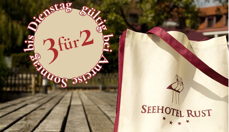 Promotional image: beige circle with '3 für 2' and 'gültig bis Dienstag' next to a Seehotel Rust shopping bag on a wooden deck.